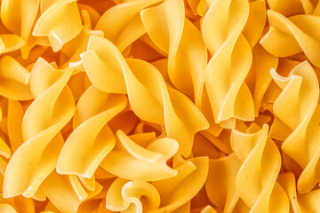 Fusilli spaghetti pattern background. Fusilli background.Macaroni or pasta background