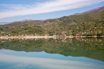 Fototapeta na wymiar Village houses and reflections in Bosnia and Herzegovina.