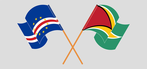 Crossed and waving flags of Cape Verde and Guyana