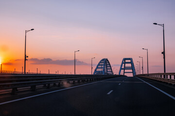 Obraz premium Crimea bridge over Kerch Strait at the evening sunset