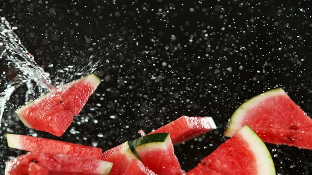 Super slow motion of sliced water melon with water splash flying in the air. Filmed on high speed cinema camera, 1000 fps.
