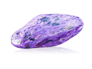 Polished violet charoite gemstone on white