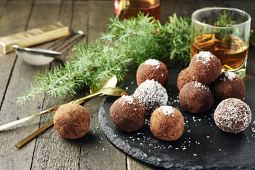 Chocolate rum balls with coconut.