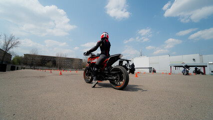 a man sits on a motorcycle. motorcycle close up