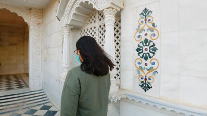 4k Hyperlapse of Indian young woman walking in Iskcon temple at Rajkot