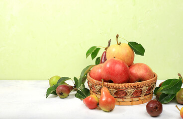 Autumn composition of apples and pears on a sunny table, thanksgiving background, harvesting, healthy natural food concept, detox diet and body cleansing, banner for screen, cafe, restaurant,