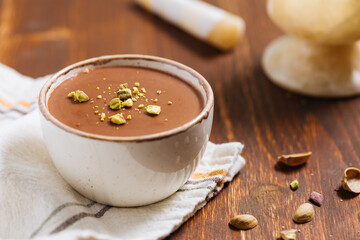 Chocolate pudding with pistachio crumbs on top