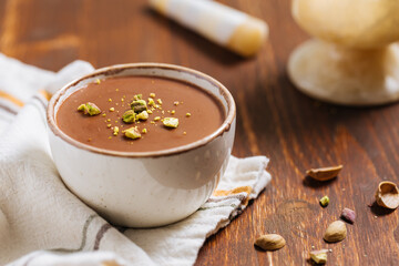 Chocolate pudding with pistachio crumbs on top