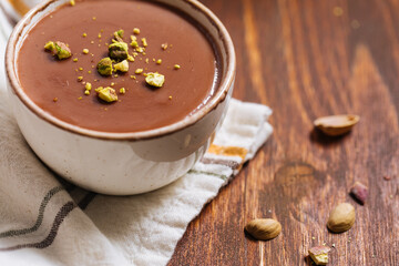 Chocolate pudding with pistachio crumbs on top