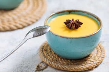 Vanilla pudding on a rustic wooden board