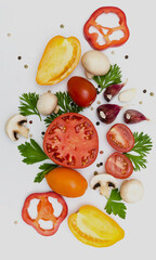top view of various fresh vegetables and herbs isolated on white