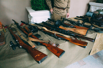 weapons on the table. machine guns in the army. old weapon