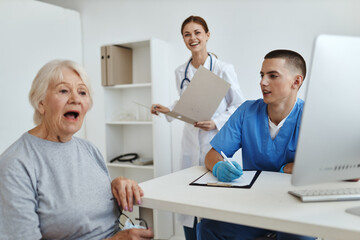 elderly woman patient at the doctor's and nurse's appointment service hospital