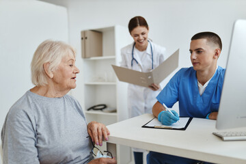 elderly woman at the hospital at the doctor's and health nurse's appointment