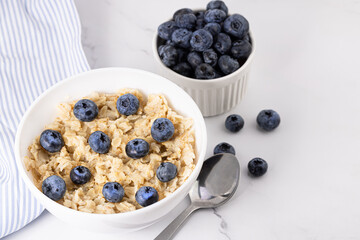 a bowl of oatmeal and blueberries. Healthy breakfast
