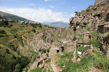Fototapeta na wymiar old abandoned ancient village Kahib in Dagestan caucasus mountains with new town on the background
