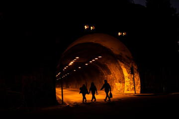 Silhoutte of people at tunnel
