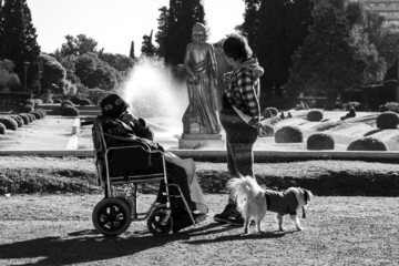 People at park fountain