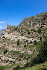 Fototapeta na wymiar ruins of the ancient village old Kahib in Dagestan, Russia with mountain on the background