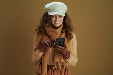 smiling young woman sending text message using smartphone