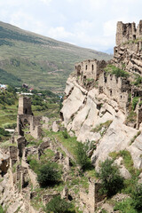 Fototapeta na wymiar old abandoned ancient village Kahib in Dagestan caucasus mountains with new town on the background