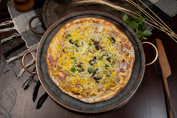 Brazilian Portuguese-style pizza with ham, egg, pepper, onion, mozzarella