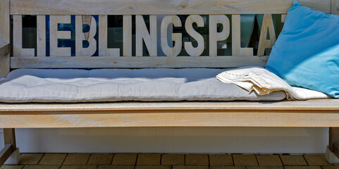 wooden bench with the word 