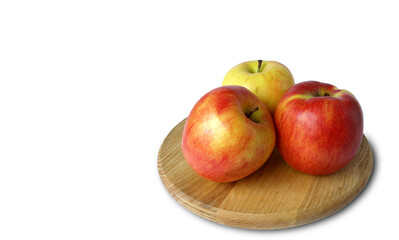 Three apples on a wooden stand
