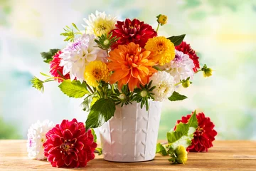 Fotobehang Autumn still life with garden flowers. Beautiful autumnal bouquet in vase on wooden table. Colorful dahlia and chrysanthemum. © Svetlana Kolpakova