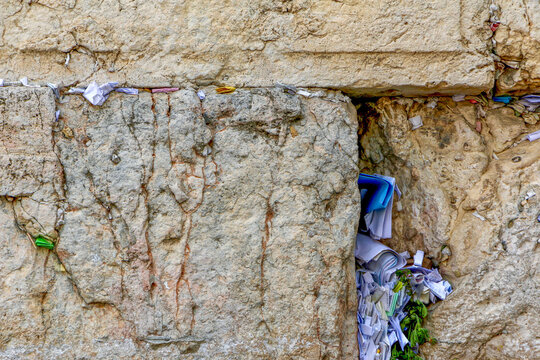 Prayers on paper in cracks on the Western Wall (Wailing Wall) in Old City, Jerusalem, Israel.