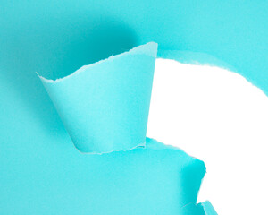 Blue torn paper whole with copyspace