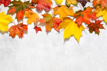 Autumn mood composition. Frame made of autumn dried leaves on white background. Flat lay, top view, copy space.