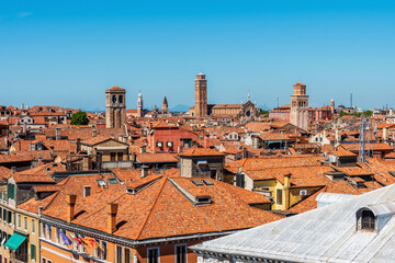 View of the rooftops of the island of Venice in Italy, the domes and church bell towers. 