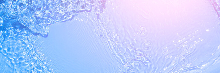 Serum texture close up. Light blue and pink gradient liquid gel background. Transparent beauty skincare sample. Cosmetic clear liquid cream smudge. Long banner with copy space