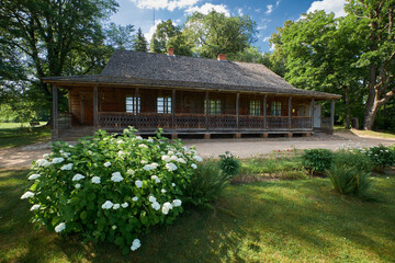 Wooden house - place of birthplace of belarusian poet Francis Bogushevich in agricultural township Kushlyany, Smorgon district, Grodno region, Belarus.
