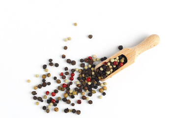 Pepper mix in scoop isolated on white background, top view
