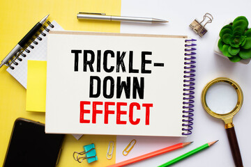 text Trickle-down effect on white paper, business concept