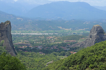 The town of Kalabaka, Greece is viewed from Meteora during a summer day.