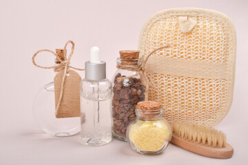 Zero waste. Serum, salt and brushes for skin care, volcanic aromatherapy stone and herbs in a glass bottle.