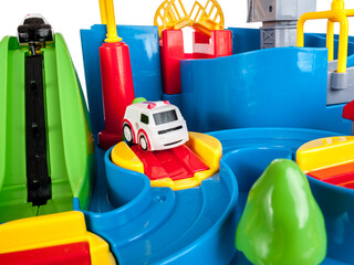 Toy town with obstacles for small cars, ambulance, police, toy slide, obstacle course