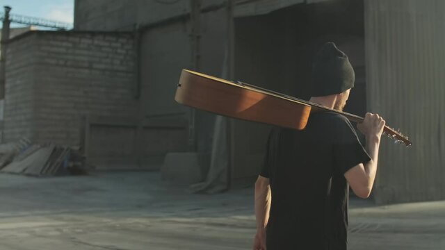 Homeless man with belongings on the street going anywhere, nowhere. broken down person, gotten into poverty, misery, been laid off, fired, sacked. social problems, unemployment concept