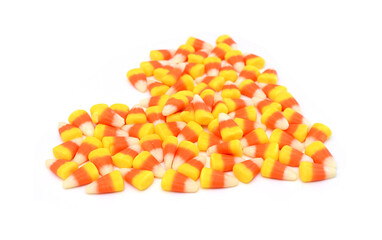 Candy corn in jar on white background