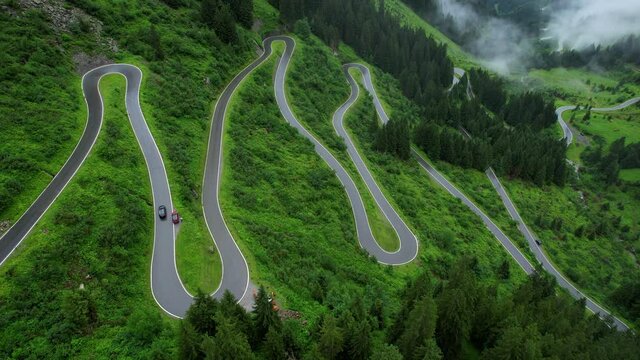 Bending streets at Silvretta High Alpine Road in Montafon Austria - travel photography by drone