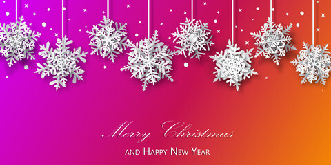 Christmas background of paper snowflakes with soft shadows, white on purple and orange background