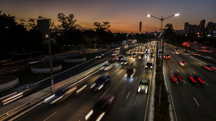 Fototapeta na wymiar Traffic on 23 de Maio Avenue, near of Ibirapuera Park, in Sao Paulo