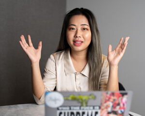 Young Edgy Asian Female Data Scientist Explaining The Scope of a Marketing Analytics Results