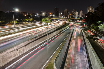 Fototapeta na wymiar Sao Paulo, Brazil, July 14 2021.Night time lapse of traffic on the famous 23 de Maio Avenue in Sao Paulo, Brazil. This avenue run past Ibirapuera Park.