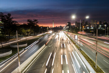 Fototapeta premium Sao Paulo, Brazil, July 19, 2021. Traffic on 23 de Maio Avenue, near of Ibirapuera Park, in Sao Paulo