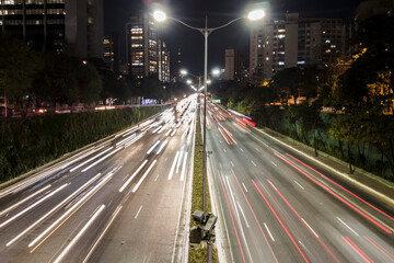 Fototapeta na wymiar Motion lapse of traffic jan on 23 de Maio Avenue at night, in south side of Sao Paulo city.