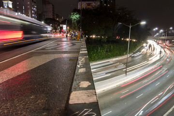 Sao Paulo, Brazil, July 27 , 2021. Night of vehicles and pedestrians traveling along the Santa Generosa Viaduct and heavy traffic on 23 de Maio Avenue.